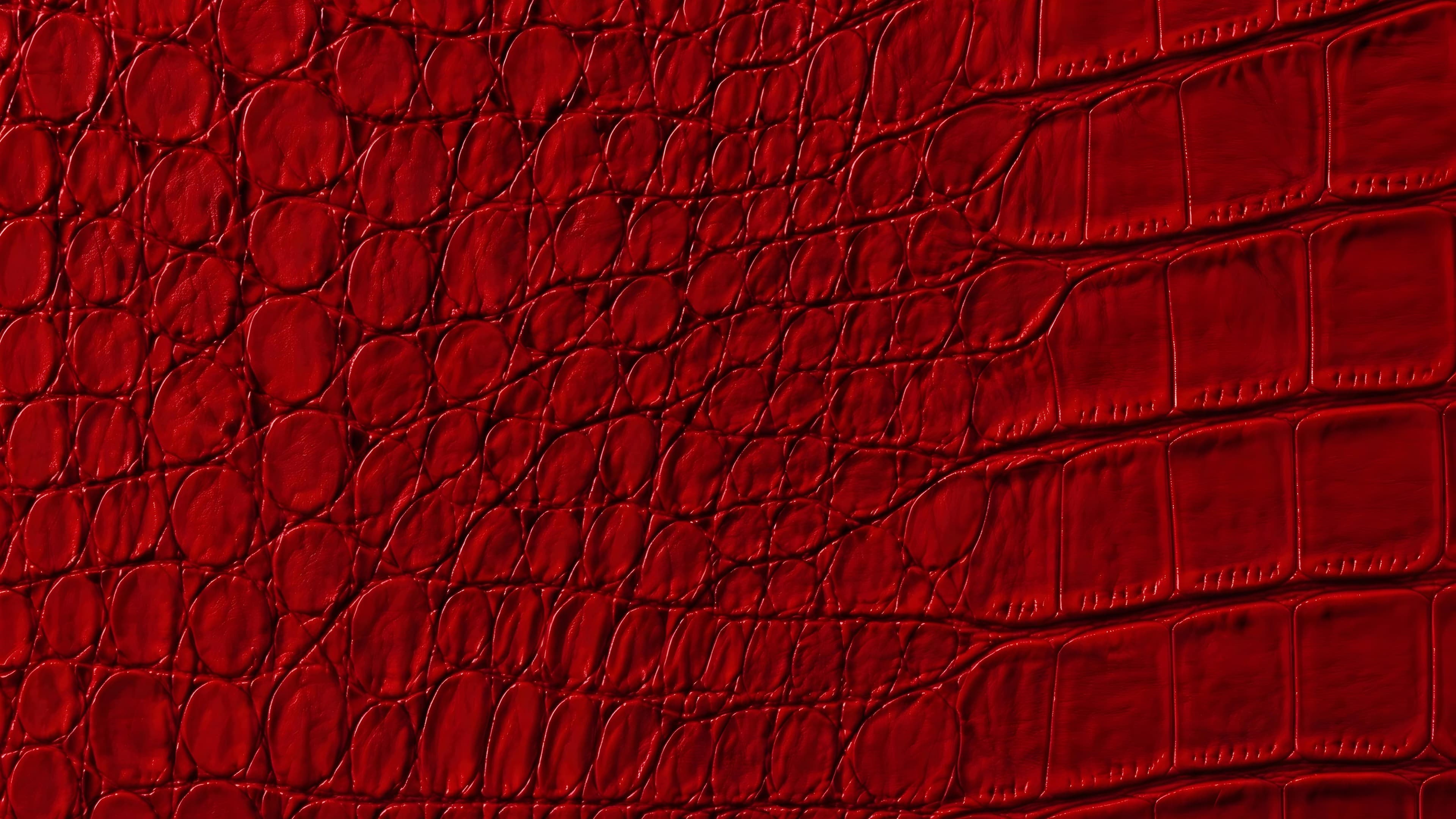 The ROSSO IMPERIALE material — crocodile relief in raking light.